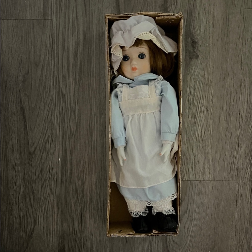 Elegant Blue and White Doll with Bonnet